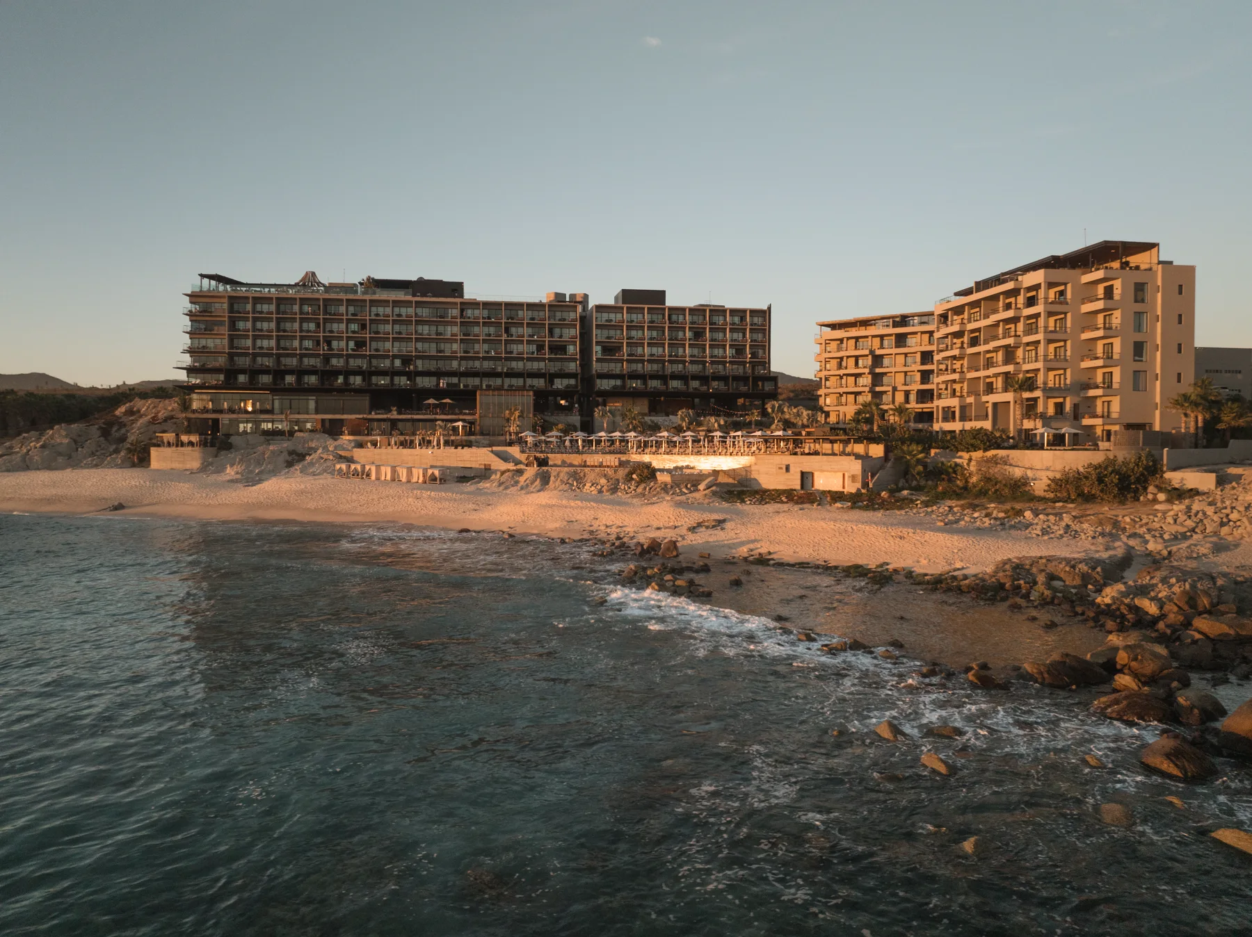 The Cape, a Thompson Hotel, on the beach in Los Cabos at dusk