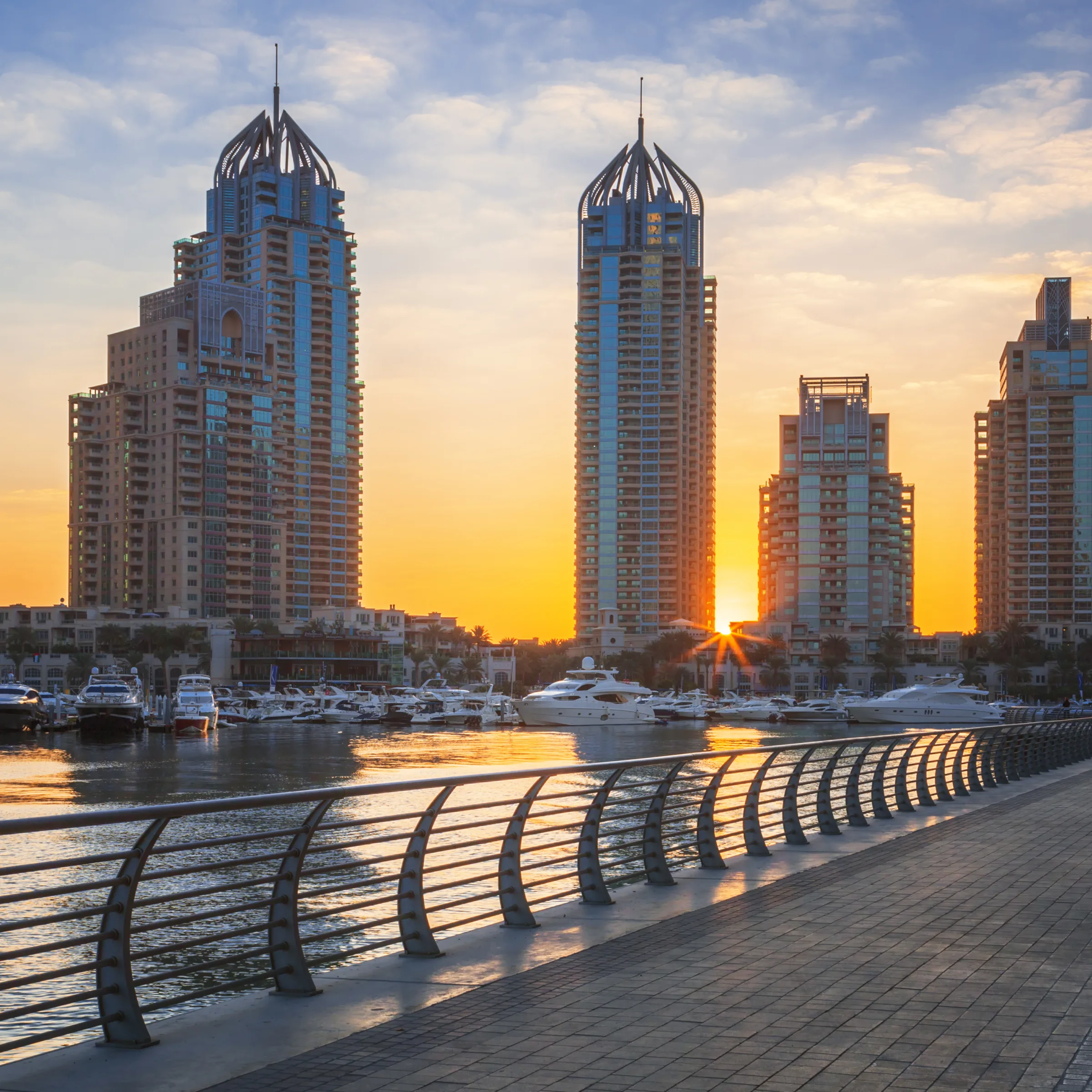 The towers of Dubai Marina at sunset, from the waterfront promenade